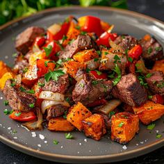 a plate filled with meat and vegetables on top of a table