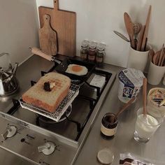 a toaster sitting on top of a stove covered in food