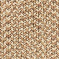 a close up view of a woven fabric with brown and tan colors on it,