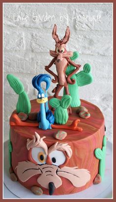 a cake decorated to look like cartoon characters