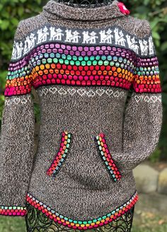 Peruvian handcrafted alpaca wool blend sweater, turtleneck with a flower attached. Light weight very comfortable Casual Multicolor Alpaca Sweater, Bohemian Alpaca Knitted Sweater, Cozy Hand Knitted Alpaca Sweater, Cozy Alpaca Long Sleeve Sweater, 100% Peruvian Alpaca Sweater Women, Mexican Sandals, Open Toed Heels, Red Bracelets, Wool Blend Sweater