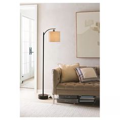 a living room scene with focus on the floor lamp