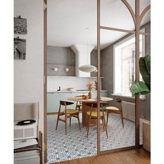 a kitchen with a table and chairs in it