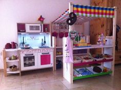 a child's play kitchen with lots of toys