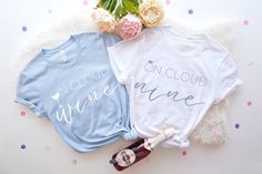 three t - shirts with bride and groom names on them sitting next to each other