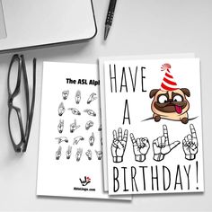 two greeting cards with the words have a birthday written on them next to a computer keyboard