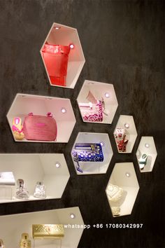 several hexagonal mirrors are hanging on the wall