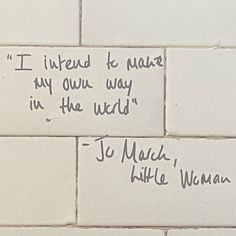 a white brick wall with some writing on it and someone's handwritten message