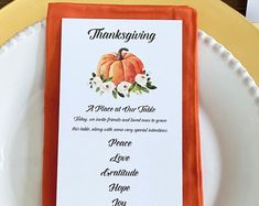 a thanksgiving place card on an orange and white plate