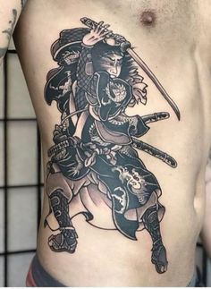 a man with a samurai tattoo on his stomach