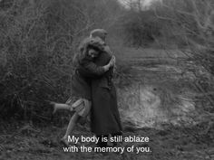 a man and woman hugging in the woods next to a river with text that reads, my body is still stabilized with the memory of you