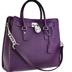 Gently Used Michael Kors Purple Large Hamilton Lock & Key Handbag Details: This Timeless Handbag Features Scratch-Resistant Saffiano Leather In A Bright Hue That Provides Rich Texture And Style To This Structured Bag. Embellished By A Chunky Monogrammed Padlock And An Elegant Chain-And-Leather Shoulder Strap To Upgrade Your Look Whenever You Want! Also Features Two Hand Straps, Snap Top Closure, Inside Zipper Pocket, 4 Inside Wall Pouch Pockets, Key Clip And Protective Metal Feet. Size Approx. 14" W X 13" H X 6" D Approx. 4.5" Strap Drop 12.5" Shoulder Strap Drop Minor Scuff Marks On Bottom Corner Edges As Pictured 100% Authentic Smoke Structured Bag, Locks & Key, Timeless Handbag, Zipper Pocket, Pocket Pouch, Shoulder Strap, Michael Kors, Bag Lady, Handbags