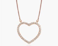 14K Rose Gold Lab-Created Diamond Open Heart Pendant Necklace. Slim and sparkling, make a simple statement of love with this classic lab-created diamond heart pendant. Crafted in 14K gold, this petite style features lab-created round brilliant-cut diamonds along the facing edge. This pendant is attached to a box chain and that secures with a spring-ring clasp. The necklace measures 18inches with an extra jump ring at 16 inches for versatility. Rose Gold Open Heart Diamond Necklace, Rose Gold Diamond Open Heart Necklace, Rose Gold Heart Pendant Diamond Necklace, Rose Gold Heart Diamond Necklace For Valentine's Day, Rose Gold Diamond Heart Pendant Necklace, Rose Gold Diamond Heart Necklace With Charm, Rose Gold Heart-shaped Diamond Necklace, Dainty Rose Gold Diamond Heart Necklace, Rose Gold Heart Pendant Diamond Necklace For Wedding