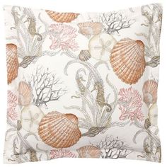 a pillow with shells and corals on it