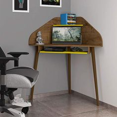 a desk with a computer monitor and game controller on it, in a living room