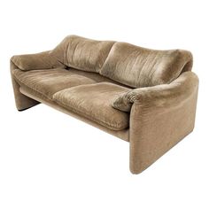 a brown couch sitting on top of a white floor