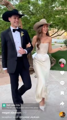 a man in a suit and tie walking next to a woman wearing a white dress