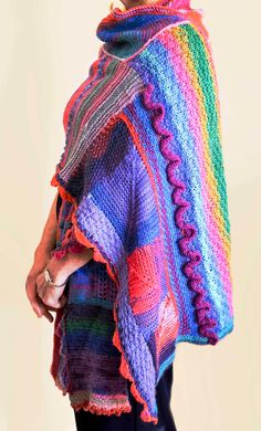 Looking for some rainbow vibes? This one of a kind, visually stunning, hand-knit wrap is a showstopper. Perfect for young and old alike--add some drama to your wardrobe! Multicolor Yarn Shawl, Multicolor Hippie Shawl One Size, Multicolor One Size Hippie Shawl, Multicolor One-size Hippie Shawl, Hippie Multicolor One-size Shawl, Bohemian Multicolor Hand-knitted Poncho, Bohemian Multicolor One Size Wraps, Bohemian Hand Knitted Shawl, Bohemian Hand-knitted Shawl