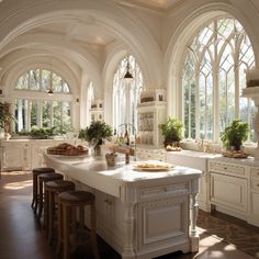 a large kitchen with lots of windows and white cabinets