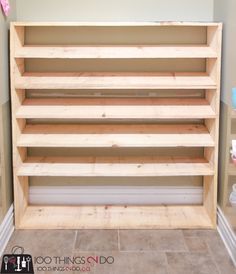 an unfinished shelving unit in the corner of a room