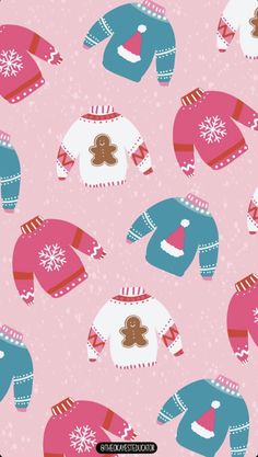 a pink and blue sweater with gingerbreads on it is shown in the background