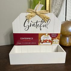 a white wooden box with a sign that says grateful on the front and center piece