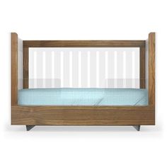 a wooden crib with a blue mattress in it