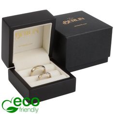 an open box with two wedding rings in it