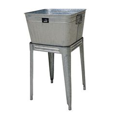 an old metal cooler sitting on top of a table