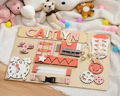 there is a wooden board with many different things on it, including toys and stuffed animals