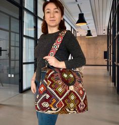 Add a unique piece to your winter outfit style with a bohemian carry-all large tote with tassels colored with natural root dyes in a hand-woven traditional wool rug. Handle and upper part are made of genuine leather. You can remove the strap according to your daily style. You can use this purse as a shoulder bag or handbag. Shoulder strap is adjustable. Suitable for using as a crossbody bag. Together with the bag, we will send two straps, one in real leather and one in guitar strap. You can use Yarn Tassel, Aztec Pattern, Personalized Gifts For Her, Unique Bags, Daily Style, Guitar Strap, Outfit Style, Boho Stil, Large Tote