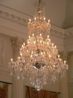 a large crystal chandelier hangs from the ceiling