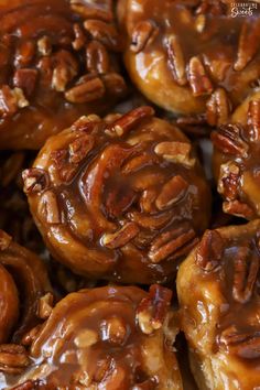 some pecans are covered in caramel sauce and drizzled with chocolate