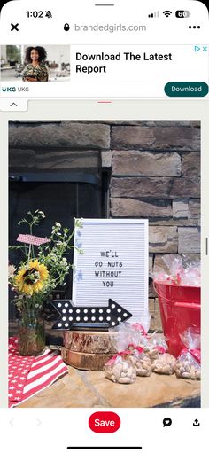 the screen is showing an image of flowers and other items in front of a fire place