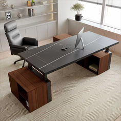 an office desk with a laptop on it