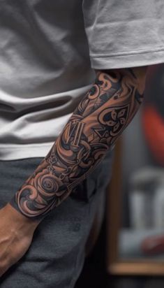 a man with a tattoo on his arm