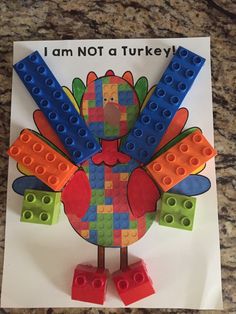 a turkey made out of legos sitting on top of a white paper with the words i am not a turkey