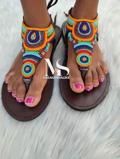 100% handmade using leather and fine beads. Masai beaded sandals are made using the pure original leather and quality African beads.They are inspired by the Masai community They are perfect for any occasion. True to size. We ship worldwide. Feel free to send me a convo for any clarifications Beaded Leather Sandals, Sandals Colorful, Custom Sandal, Colorful Sandals, African Shoes, Bohemian Sandals, Colored Sandals, Custom Made Shoes, Handmade Sandals