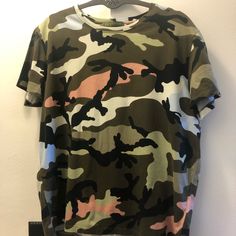 Valentino Camouflage T-Shirt Size S In Great Condition, No Damage In A Smoke-Free Home & No Smell. Has Gold Rock Stud On Top Back (Shown In Pics). Runs Small. Camouflage Graphic Print Crew Neck T-shirt, Military Style Green Tops For Streetwear, Camouflage Crew Neck T-shirt With Graphic Print, Green Military Style T-shirt With Crew Neck, Green Military Crew Neck T-shirt, Green Military Style Crew Neck T-shirt, Green Military Crew Neck Top, Summer Camouflage Cotton T-shirt, Green Military Style Short Sleeve Top