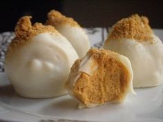 pumpkin cream cheese truffles on a white plate