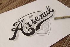 a pencil sitting on top of a piece of paper with the word ascend written in cursive writing