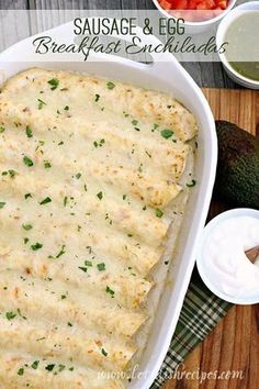 an enchilada in a white casserole dish on a wooden cutting board