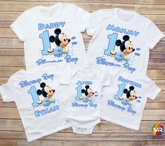 three baby onesuits with mickey mouse on them