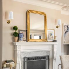 a living room with a fire place and a mirror on the fireplace mantels