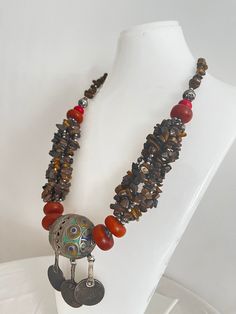 This necklace is a perfect gift for someone who truly loves and appreciates beautiful gemstones. I can only say that it is a beautiful piece of jewelry that will really make you stand out from the crowd. This necklace is made of huge beads. * Antique Moroccan Berber Necklace Handmade with coins, the necklace features an intricate pattern in its texture, a beautiful Berber piece of jewelry that radiates Moroccan Berber history and cultural significance, each handcrafted by artisans qualified from Bohemian Agate Jewelry With Natural Stones, Handmade Bohemian Agate Jewelry, Bohemian Agate Pendant Jewelry, Artisan Gemstone Bead Pendant Jewelry, Artisan Pendant Jewelry With Gemstone Beads, Artisan Jewelry Pendant With Gemstone Beads, Bohemian Jewelry With Round Beads And Stones, Bohemian Gemstone Pendant Jewelry, Bohemian Jewelry With Round Beads Stones