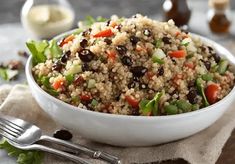 a white bowl filled with rice and vegetables