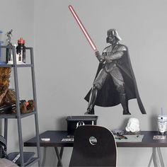 a star wars themed bedroom with a darth vader wall decal