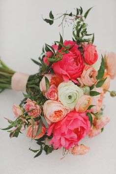 a bridal bouquet with pink and white flowers