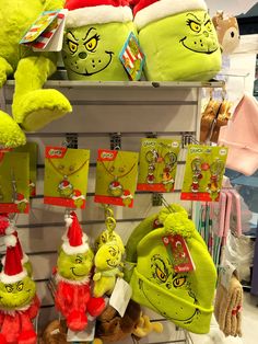 stuffed animals and hats are on display in the store for children's christmas gifts