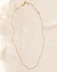 Add some dazzle to your daily stack with the Camilla Necklace. This sparkling piece will elevate any look, perfect for any occasion. Details: - Gold filled - 16" length + 2" adjustment - Hypoallergenic & Waterproof Delicate Adjustable Necklaces With Satellite Chain, Adjustable Tarnish-resistant Choker Necklace, Gold Crystal Necklaces With Adjustable Chain For Everyday, Everyday Gold Crystal Necklaces With Adjustable Chain, Gold Crystal Necklace With Adjustable Chain For Everyday, Adjustable Satellite Chain Necklace Gift, Adjustable Satellite Chain Choker, Dainty Adjustable Beaded Necklaces With Satellite Chain, Stackable Necklaces